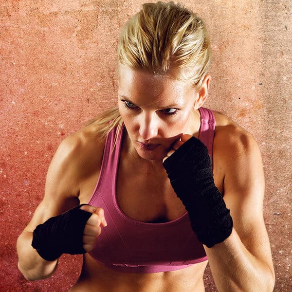 Mixed Martial Arts Lessons for Adults in Louisville  KY - Lady Kickboxing Focused Background
